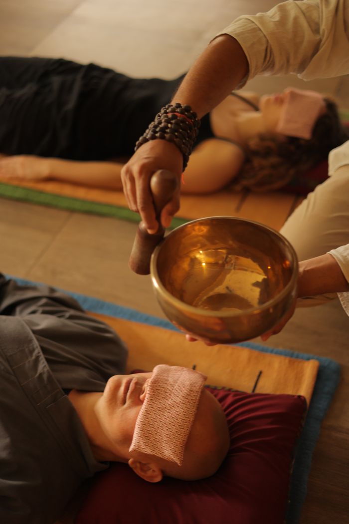 Peaceful meditation session using a singing bowl for sound therapy.