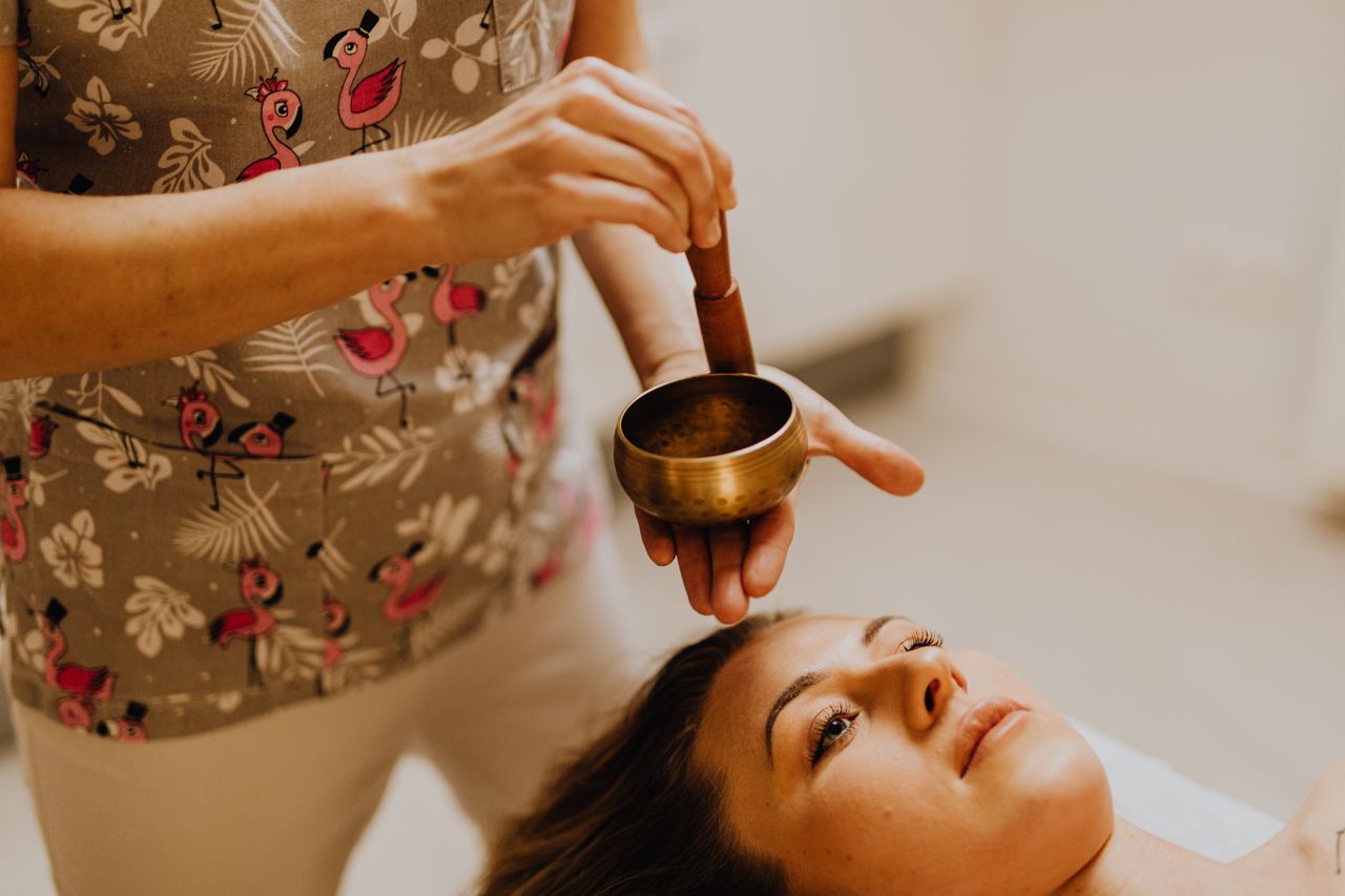 Calming therapy session with Tibetan singing bowl for relaxation and stress relief.